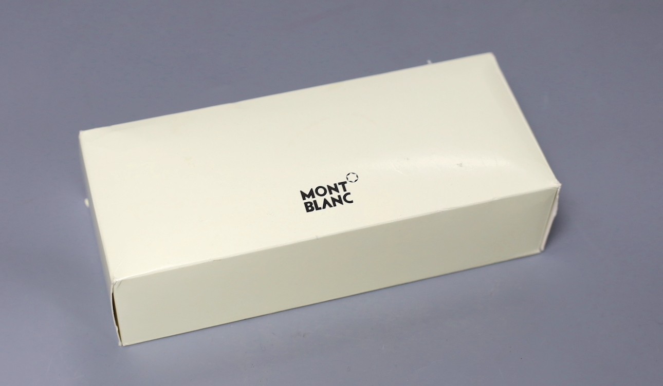 A Mont Blanc retractable ball point pen with original case, cardboard sleeve and service instructions